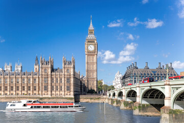 Big Ben and Houses of Parliament with boat in London, UK