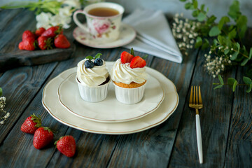 Two cheesecakes decorated with fruit on a white plate, delicious dessert