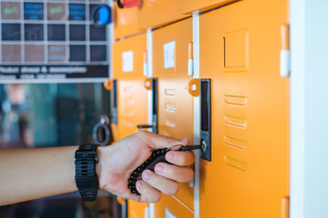 Gym lockers in orange color with handles and key lock. Orange Metal locker cabinets for gym and locker rooms in college. 