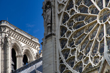 Slow travel in Paris - discovering the little things: View of a rose window and a steeple of a...