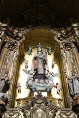 baroque altarpiece in a church (carmelitas e carmo) in porto (portugal)