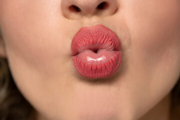 Naklejka premium female lips with kissing gesture