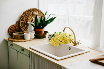 retro design kitchen with white sink and green refrigerator in a wooden rustic house with cute wood...