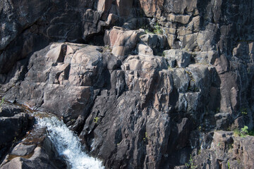 Mountain rock wall in the forest.