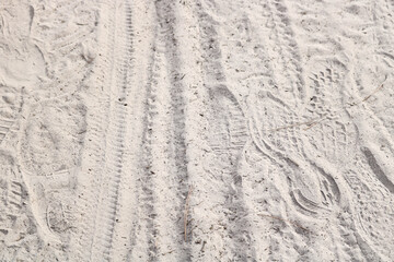 footprints on the sand pavement.