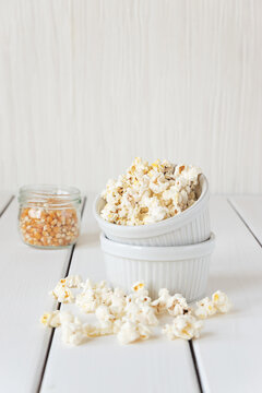 Popcorn And Corn Grains On A White Background