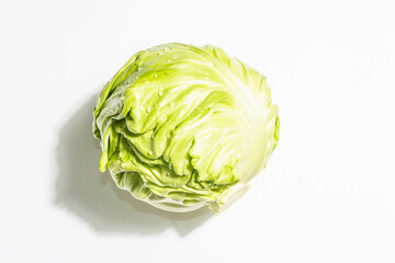 Fresh young cabbage, whole head isolated in white background