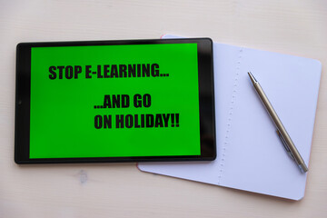 Tablet showing black text on green background 