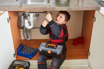 Handyman child with tool box