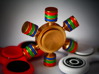 Closeup shot of a colorful cool fidget spinner - obrazy, fototapety, plakaty