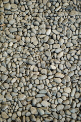 Plenty of grey and brown gravel stones in close-up view