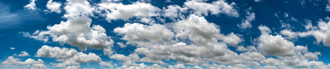Panorama Blue sky and white clouds. Bfluffy cloud in the blue sky background.Vivid sky on white...