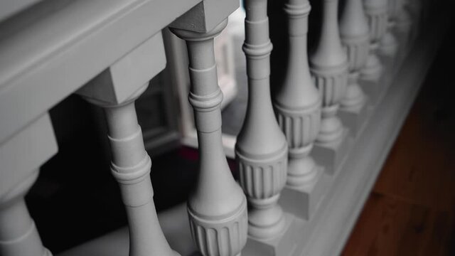 Cool white railing on the beautiful staircase leading to the historic building. Taking a close-up of an object