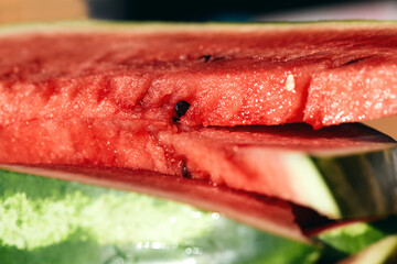 Close up of fresh ripe red watermelon fruit slices. Summer thirst-quenching snack.