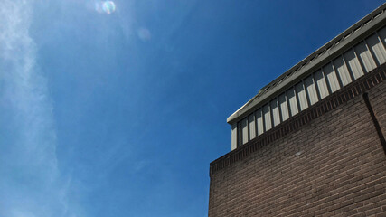 Fototapeta premium City-scapes looking up on a bright sunny summer day. Bright sky with space for text.