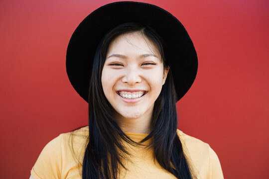 Happy asian hipster woman smiling on camera - Focus on face