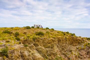 Camper camp on cliff, coast in Spain