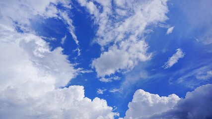 background blue sky with white cumulus clouds texture
