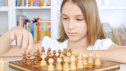 Kid Playing Chess in Library, Child Practicing, Learning, Teenager Blonde Girl Studying Brain Game