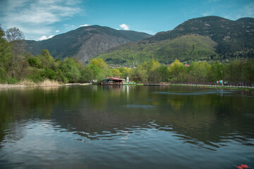 Lake by the mountain with reflection in the water of nature