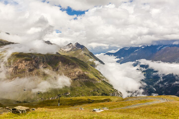 Panorama of cloud layer from mountain top over Swiss alps
