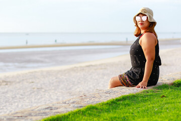 Portrait of young asian women at beautiful beach. Travel on vacation in summer season. Enjoy with...