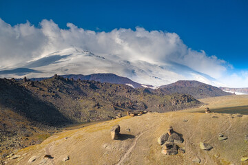 Valley of stone mushrooms under Elbrus mountain