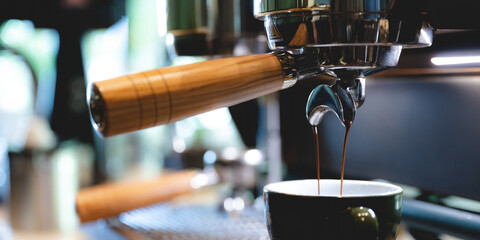 professional barista making espresso coffee to a drink cup in cafe, beverage caffeine machine,...