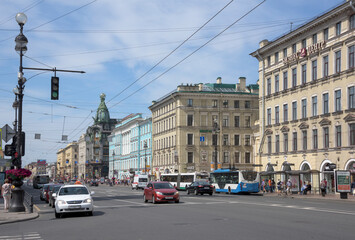 Fototapeta na wymiar Nevsky Avenue with moving on it pedestrians and cars
