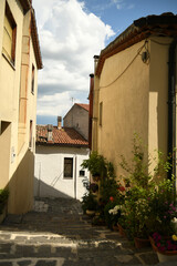 A small street between the old houses of Muro Lucano, a medieval village in the mountains of the Basilicata region in Italy