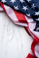 Concept of Independence day or Memorial day. Flag over bright marble table background.