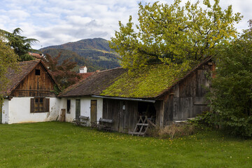 Old farmhouses in Alpine village with mountain view