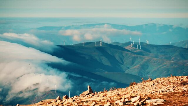 Mountain view with wind turbines. View from Torre mountain peak of Serra da Estrela in Portugal.