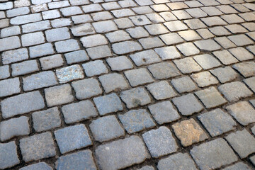 Gray texture of paving stones in the old part of the city.