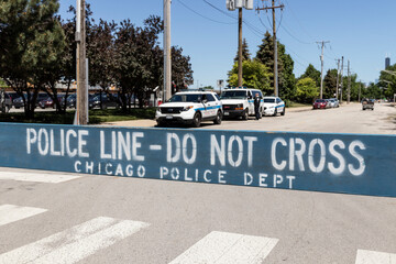 POLICE LINE DO NOT CROSS sign courtesy of the Chicago Police Department.