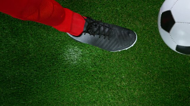 Close-up Foot Falling Soccer Ball, Super Slow Motion at 1000 fps. Filmed on high speed cinematic camera.