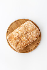 Whole grain bread on cuttin board. Top view