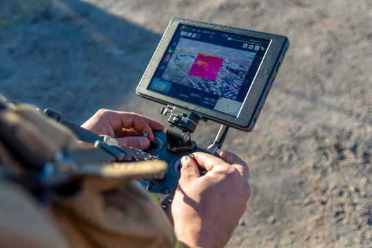 San Rafael, Argentina, June 12, 2021: firefighter flying drone with thermal camera