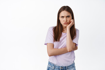 Sulking angry girlfriend frowning, pouting and looking offended, being insulted, upset about...