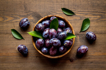 Layout set of ripe purple plums. Top view