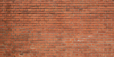 Panoramic view of grunge weathered red brick wall texture background