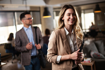 Businesswoman in office. Smiling businesswoman using the phone
