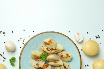 Concept of tasty food with vareniki or pierogi on white background
