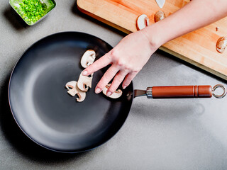 Mushroom cooking on non stick frying pan