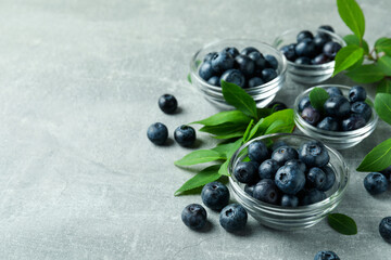 Fresh berry concept with blueberry on gray textured table