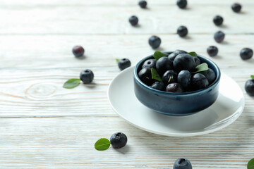 Fresh berry concept with blueberry on white wooden table