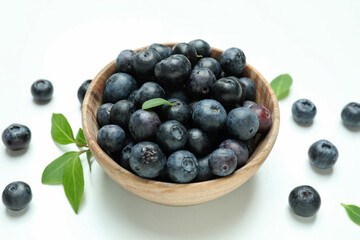 Fresh blueberry with leaves on white background
