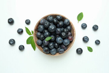 Fresh blueberry with leaves on white background
