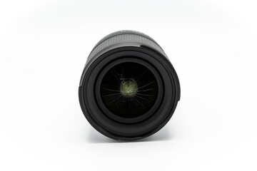 Broken mirrorless or DSLR camera lens isolated on white background