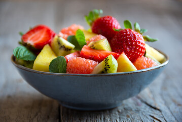 Fruit salad with cut fresh fruit and mint